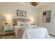 Bright bedroom with a chandelier, neutral decor, two bedside tables, and a cozy bed at 109 W Markham Ave, Durham, NC 27701