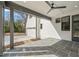 Covered porch with tiled flooring and ceiling fan offers outdoor living space at 109 W Markham Ave, Durham, NC 27701