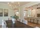 Open concept dining area leading to the kitchen and other living spaces at 109 W Markham Ave, Durham, NC 27701