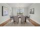 Formal dining room with modern chandelier, seating for six and neutral color palette at 109 W Markham Ave, Durham, NC 27701