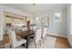 Open dining room with chandelier adjacent to the kitchen at 109 W Markham Ave, Durham, NC 27701