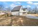 Rear exterior shows the spacious driveway and attached garage at 109 W Markham Ave, Durham, NC 27701
