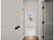 Bright hallway view showcasing the Primary bathroom with double sink and natural light at 109 W Markham Ave, Durham, NC 27701