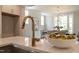 Modern kitchen with a quartz countertop and open view to dining area at 109 W Markham Ave, Durham, NC 27701