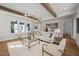 Bright living room with wood beams, modern furnishings and open concept design at 109 W Markham Ave, Durham, NC 27701