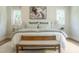 Bright main bedroom features large windows, neutral paint, rug, and furniture at 109 W Markham Ave, Durham, NC 27701