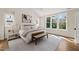 Inviting main bedroom with a comfortable bed, ample windows, and lots of natural light at 109 W Markham Ave, Durham, NC 27701