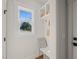 Bright mudroom features a built-in bench, storage, and natural light from a window at 109 W Markham Ave, Durham, NC 27701