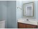 Well-lit bathroom with wood vanity and a large mirror at 12 Citation Dr, Durham, NC 27713