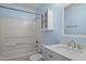 Bathroom featuring vanity, toilet, shower-tub combo, cabinet, and light blue accent wall at 12 Citation Dr, Durham, NC 27713