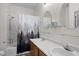 Bright bathroom with a double sink vanity and a shower-tub combo at 12 Citation Dr, Durham, NC 27713