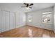 Bright bedroom with hardwood floors, double windows, and closet space at 12 Citation Dr, Durham, NC 27713