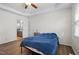 Bedroom with hardwood floors and access to an en-suite bathroom at 12 Citation Dr, Durham, NC 27713