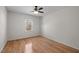Bedroom showcasing hardwood floors, natural light from window, and neutral paint scheme at 12 Citation Dr, Durham, NC 27713