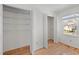 Bright bedroom featuring hardwood floors, window and two large closets for ample storage at 12 Citation Dr, Durham, NC 27713