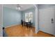 Open-concept dining area features stylish lighting and a view to the outside at 12 Citation Dr, Durham, NC 27713
