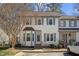 Charming townhome featuring neutral siding, gray shutters, and a delightful bay window at 12 Citation Dr, Durham, NC 27713