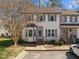 Charming townhome featuring neutral siding, gray shutters, and a delightful bay window at 12 Citation Dr, Durham, NC 27713