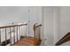 Second story landing with wood railing and hardwood floors at 12 Citation Dr, Durham, NC 27713