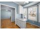 Bright kitchen featuring white island, cabinetry, with lots of natural light at 12 Citation Dr, Durham, NC 27713
