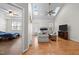 Bright living room with skylights, fireplace, ceiling fan, and hardwood floors at 12 Citation Dr, Durham, NC 27713