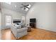Comfortable living room featuring a fireplace, hardwood floors, and a vaulted ceiling at 12 Citation Dr, Durham, NC 27713