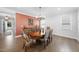 Formal dining room with decorative accent wall and round dining table at 131 English Violet Ln, Raleigh, NC 27610