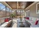 Screened in back porch with ceiling fan and multiple couches for seating at 1328 Mill Glen Cir, Raleigh, NC 27614
