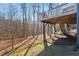 View of the wood deck and stairs looking to the wooded backyard of this single Gathering home at 1328 Mill Glen Cir, Raleigh, NC 27614