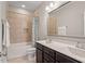 Well-lit bathroom featuring a bathtub, shower, vanity, and matching fixtures at 1328 Mill Glen Cir, Raleigh, NC 27614