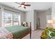 Well-lit bedroom with a large window, a comfortable bed, and stylish decor at 1328 Mill Glen Cir, Raleigh, NC 27614