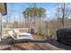 Outdoor deck featuring lounge chairs, grill and trees in background at 1328 Mill Glen Cir, Raleigh, NC 27614