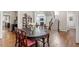 Charming dining room with hardwood floors adjacent to the staircase at 1328 Mill Glen Cir, Raleigh, NC 27614