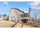 Exterior view of home with a screened in back porch and spacious backyard at 1328 Mill Glen Cir, Raleigh, NC 27614
