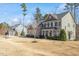 A beautiful home with a well-maintained lawn and landscaping and architectural details at 1328 Mill Glen Cir, Raleigh, NC 27614