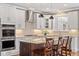 Gourmet kitchen featuring stainless steel appliances, ample counter space, and a stylish island with seating at 1328 Mill Glen Cir, Raleigh, NC 27614
