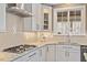 Close-up of a modern kitchen showcasing granite countertops, tile backsplash, and stainless steel appliances at 1328 Mill Glen Cir, Raleigh, NC 27614