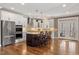Spacious kitchen with stainless steel appliances, granite countertops, and a center island with seating at 1328 Mill Glen Cir, Raleigh, NC 27614