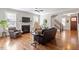 Cozy living room featuring hardwood floors, fireplace, and comfortable seating at 1328 Mill Glen Cir, Raleigh, NC 27614