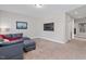 Upstairs sitting room featuring neutral walls and comfortable furnishings at 1328 Mill Glen Cir, Raleigh, NC 27614