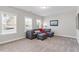 Comfortable living room with large windows providing abundant natural light at 1328 Mill Glen Cir, Raleigh, NC 27614