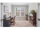 Cozy home office with built-in bookcase and large window at 1328 Mill Glen Cir, Raleigh, NC 27614