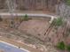An aerial view of a fenced in dog park with obstacle features in the community at 1329 Channing Park Cir, Cary, NC 27519