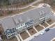 A high-angle shot of townhouses with a backdrop of lush green trees at 1329 Channing Park Cir, Cary, NC 27519