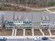 An aerial shot of a row of townhomes with colorful exteriors and well-manicured lawns at 1329 Channing Park Cir, Cary, NC 27519
