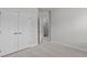 Bedroom with a large closet and open door leading to additional rooms, promoting spacious living at 1329 Channing Park Cir, Cary, NC 27519