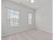 Neutral bedroom with two windows allowing ample natural light and views of the outdoors at 1329 Channing Park Cir, Cary, NC 27519