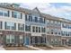 Attractive townhomes with varied siding, stone foundations, and complementary color schemes create a visually appealing streetscape at 1329 Channing Park Cir, Cary, NC 27519