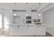 Modern kitchen with white cabinets, stainless steel appliances, and a large island perfect for entertaining at 1329 Channing Park Cir, Cary, NC 27519
