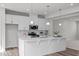 Contemporary kitchen featuring white cabinets, stainless steel appliances, and an island with ample counter space at 1329 Channing Park Cir, Cary, NC 27519